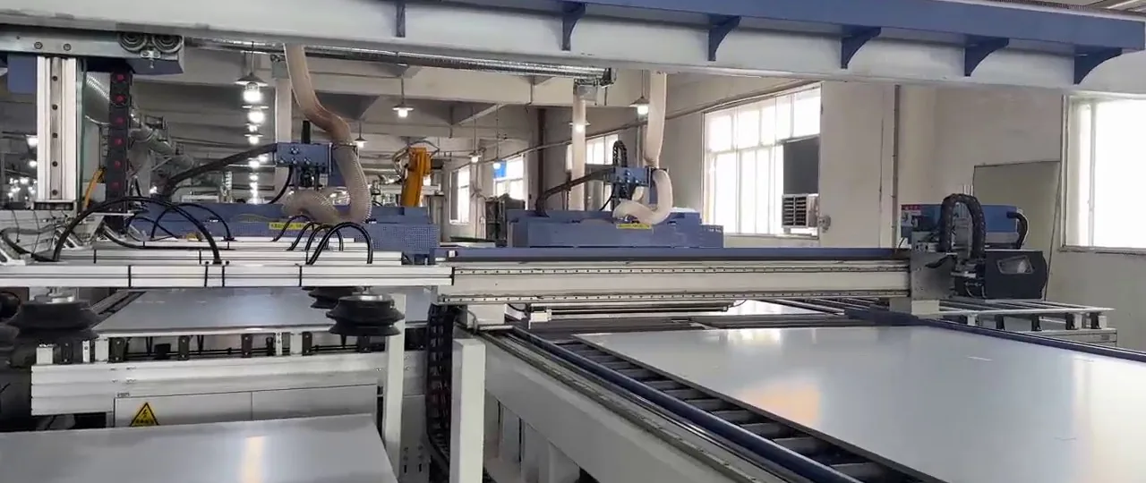 CNC machining hall with roller conveyor and panel stores on the Adam Cabinet production floor