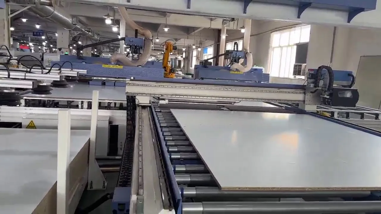 Large panels moving through the roller line on the production floor