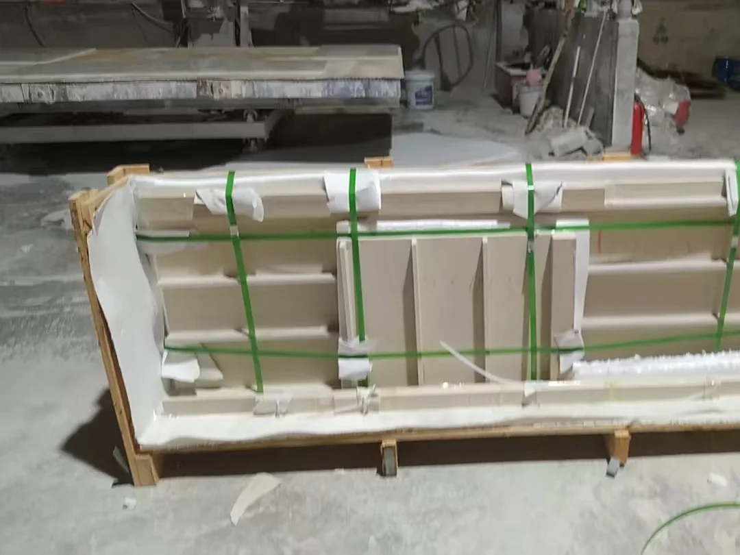 Cabinet door fronts strapped inside a wooden export crate with foam inserts and corner protection