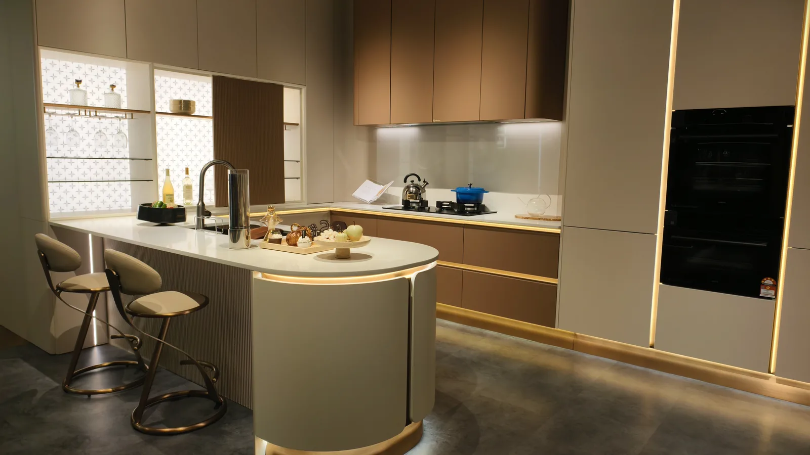 Kitchen with a stone island and integrated appliances
