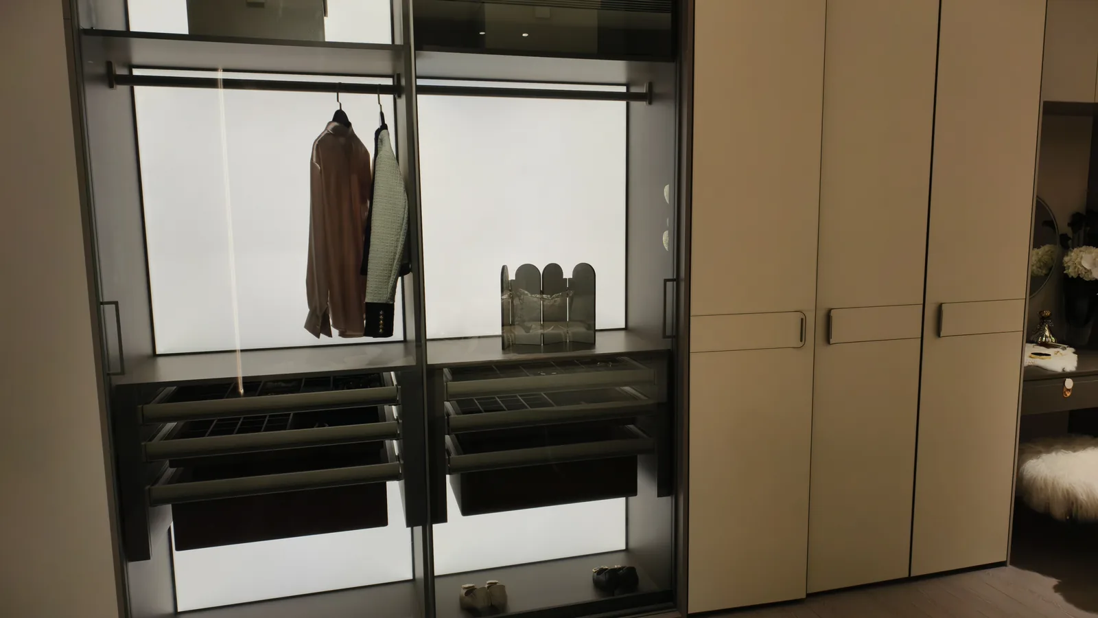 White fitted wardrobe with lit shelving