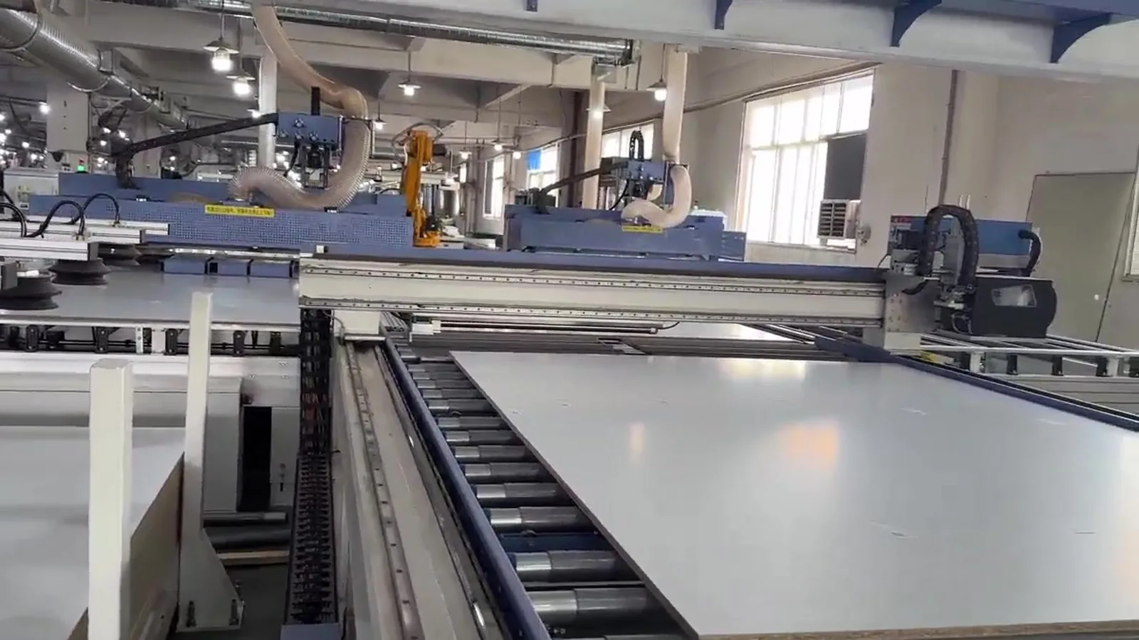 Large pale panel on a roller conveyor inside a cabinet factory