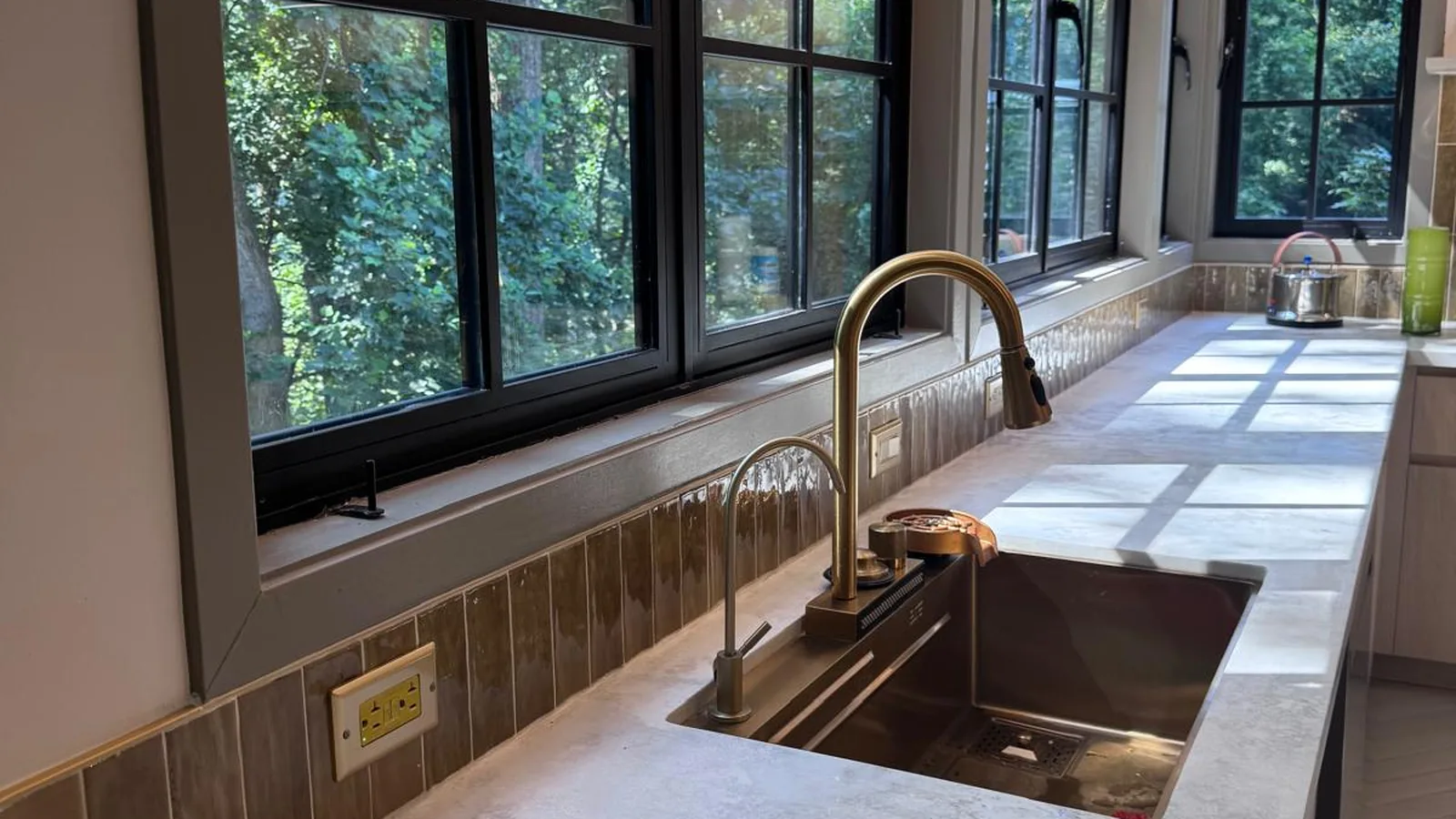 Galley kitchen with full-height cabinet run and pendant lighting