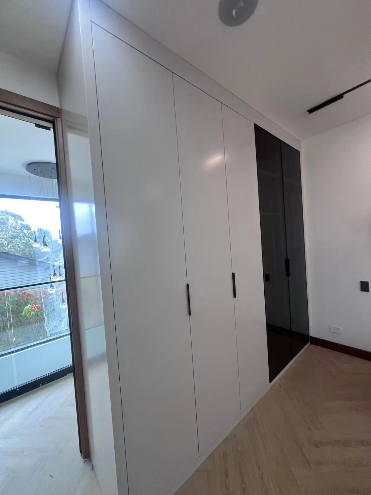 Hallway with white storage to the ceiling, UK