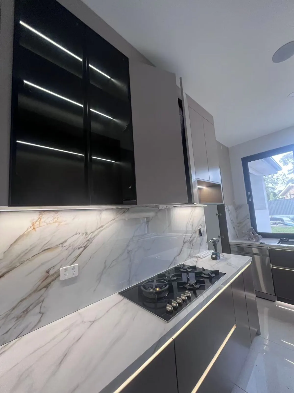 Navy two-tone kitchen with stone island, UK