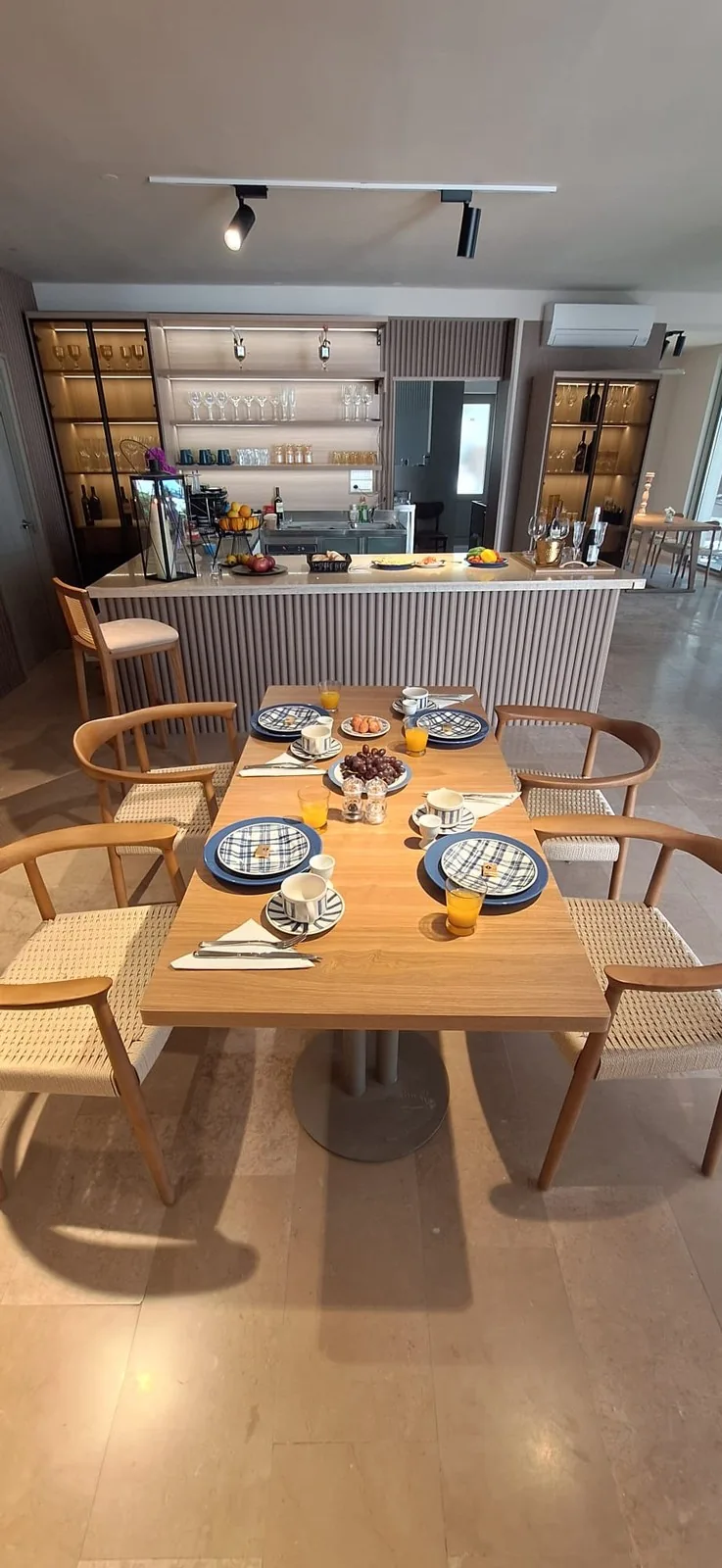Oak dining room with place settings, UK