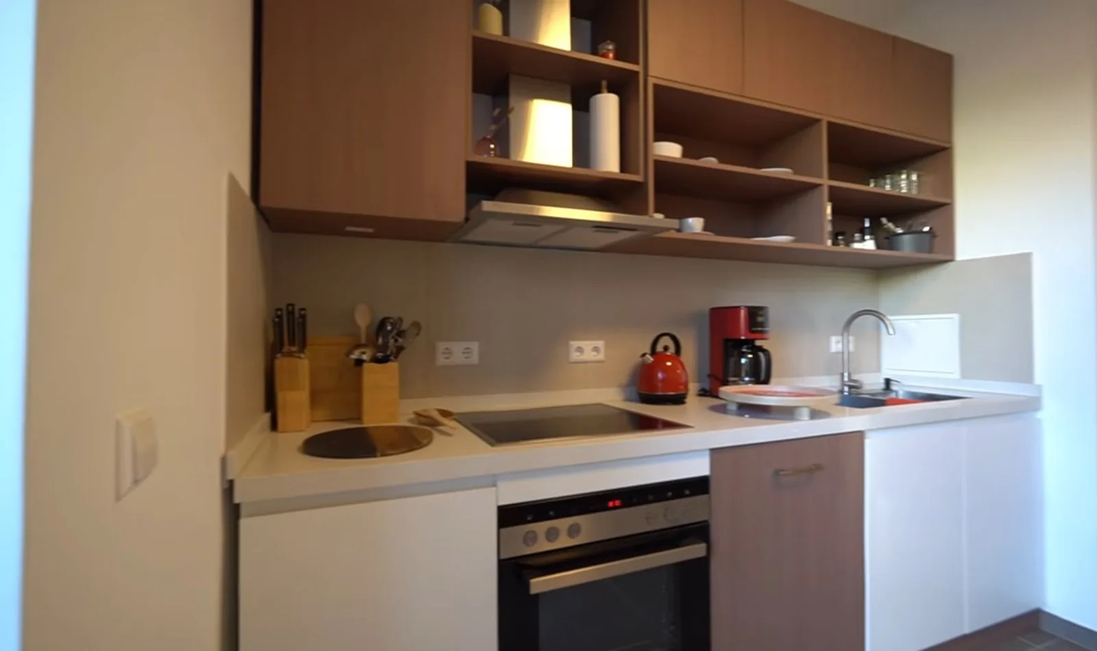 White and walnut kitchen with open shelves, UK