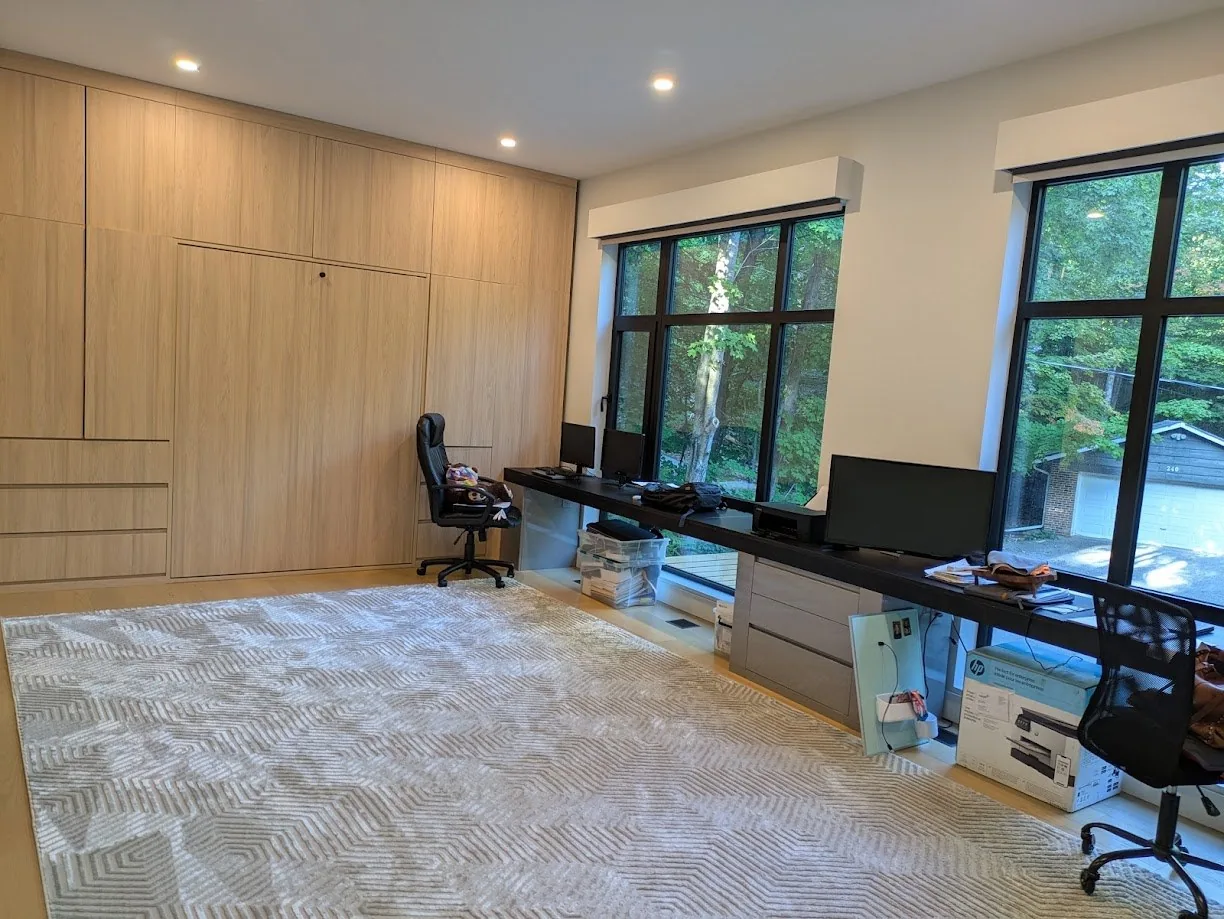 Office with wood panelling and white run, UK