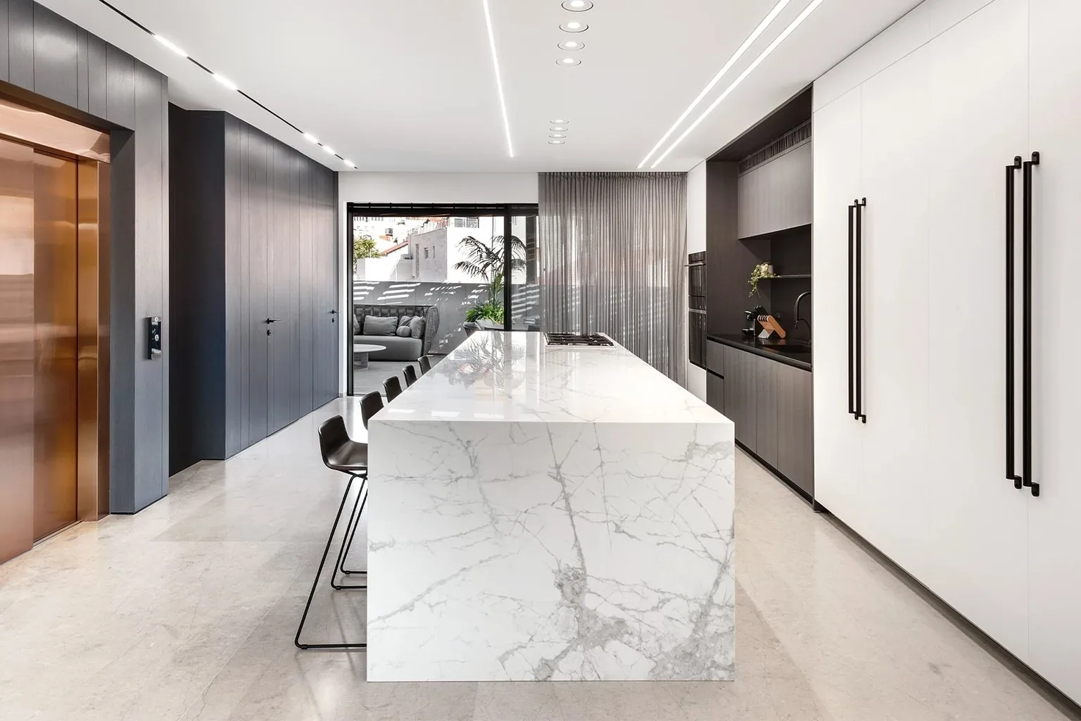 Hotel program kitchen runs in Flatstone slab, staged delivery