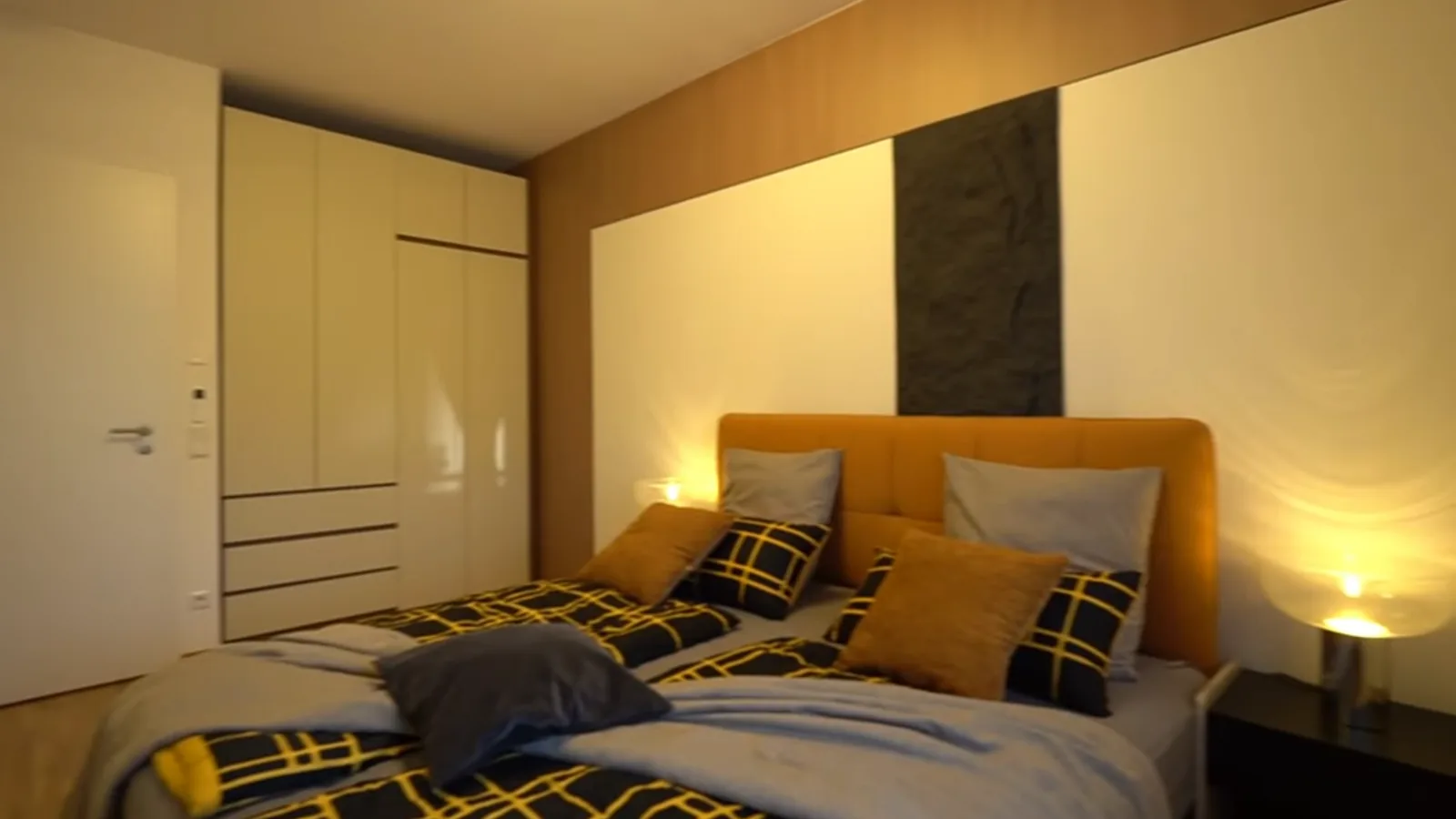 Bedroom closet with timber-tone doors in a German apartment