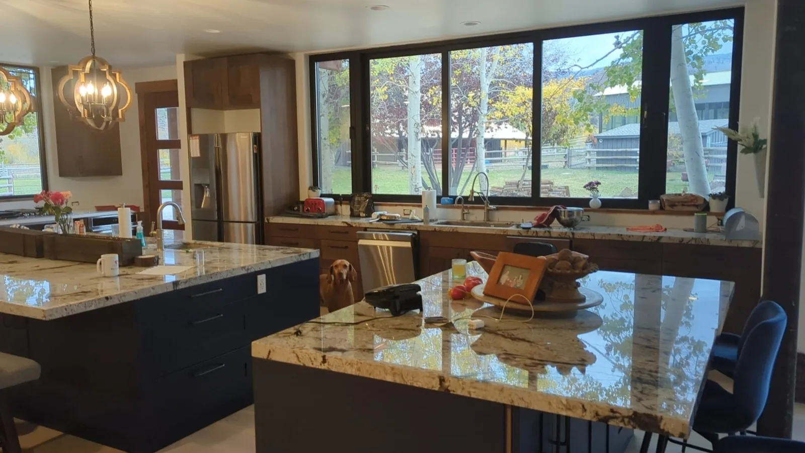 Dark walnut kitchen at the windows with the living beyond