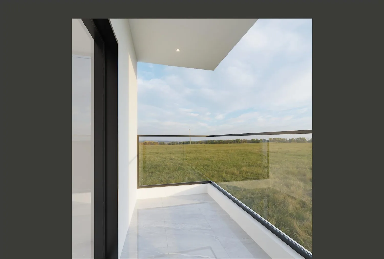 Balcony with glass railing and black-framed sliding door onto grass