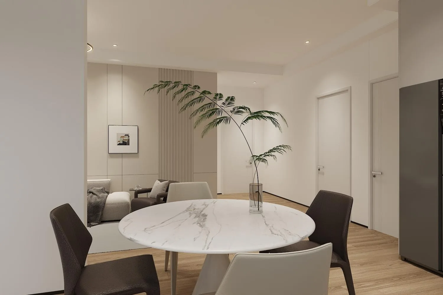 Dining area with round stone table and the open kitchen beyond
