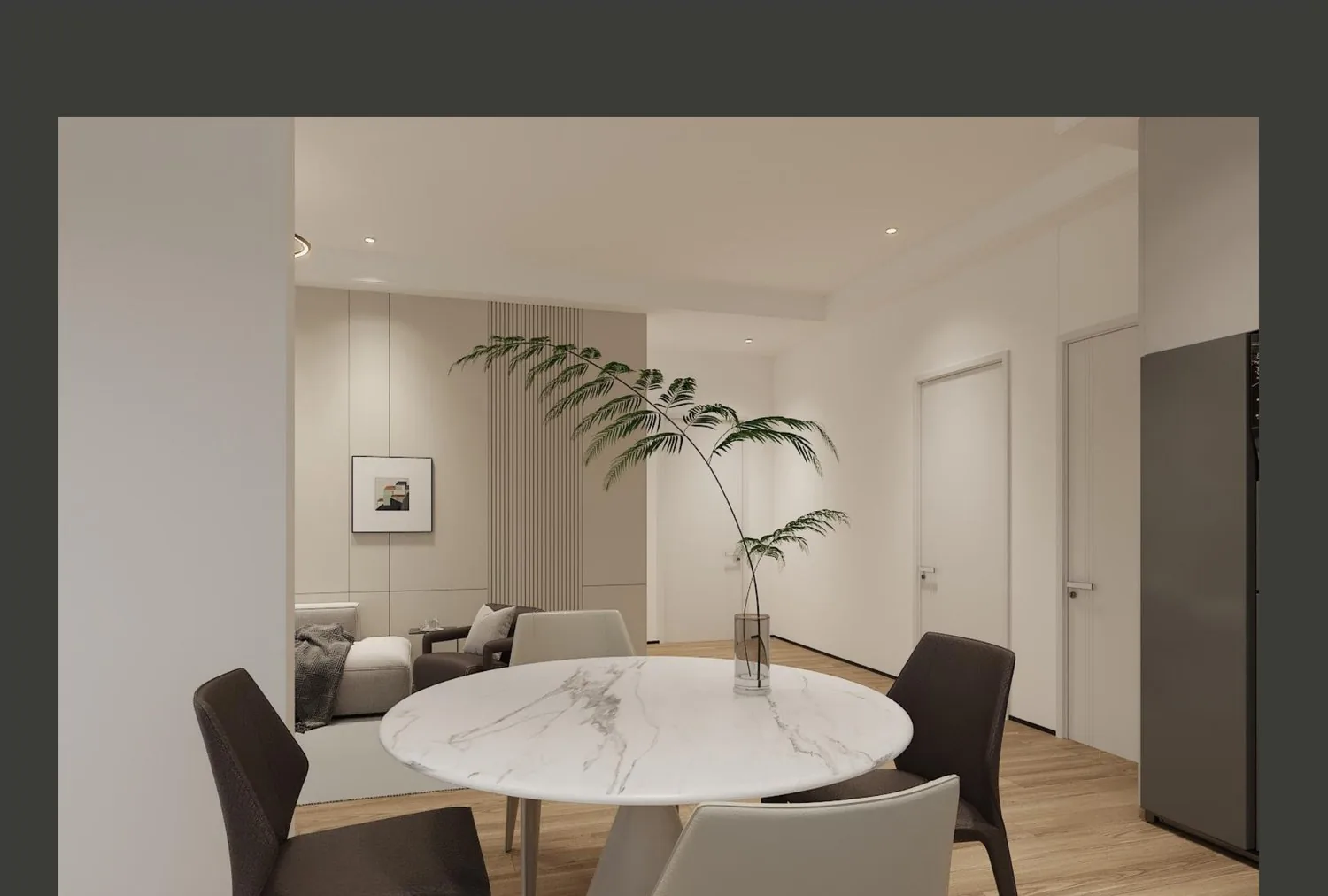 Great room seating area with sofa, armchairs, plant and framed art