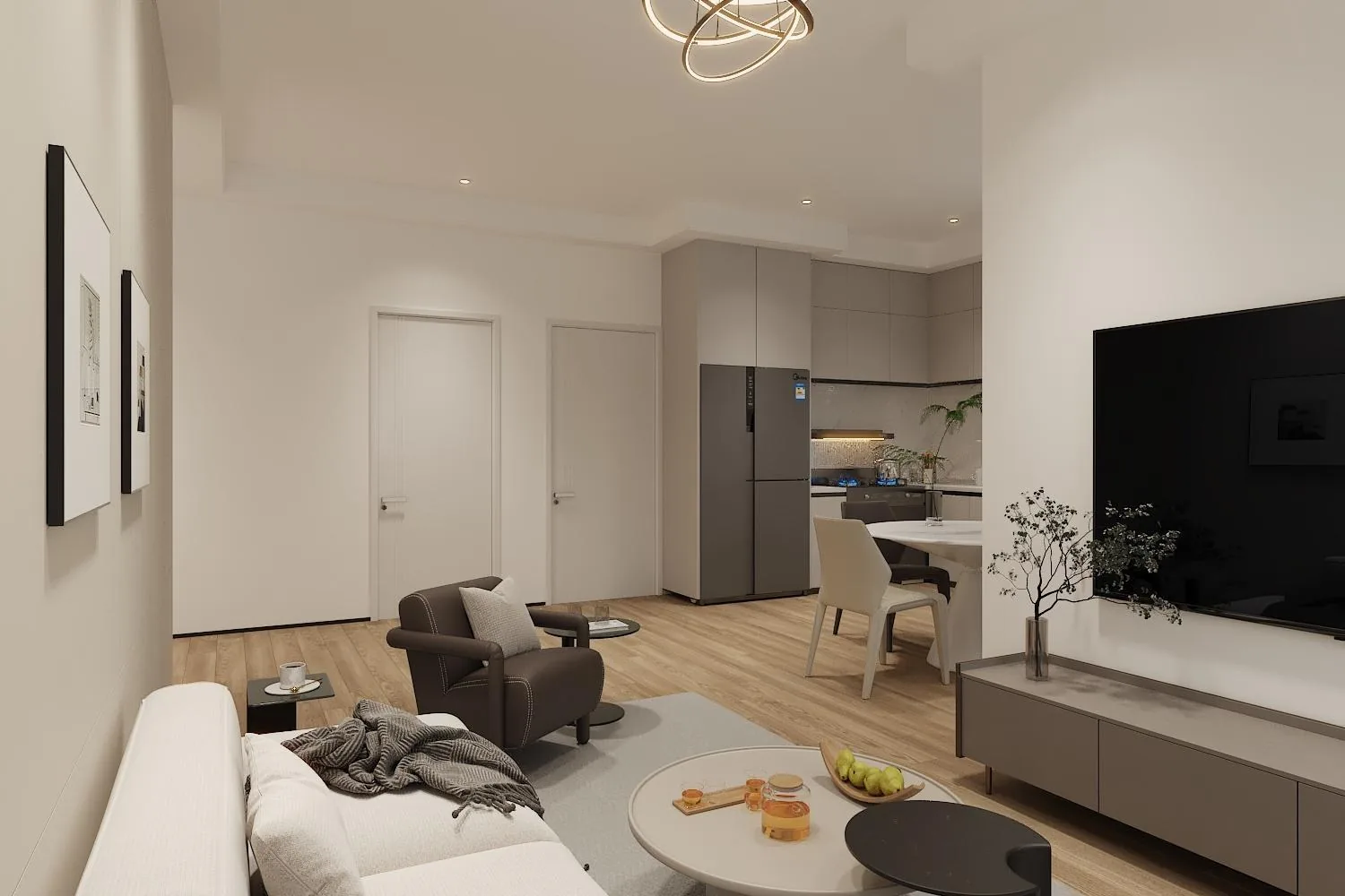 Great room with TV feature wall and the open kitchen beyond