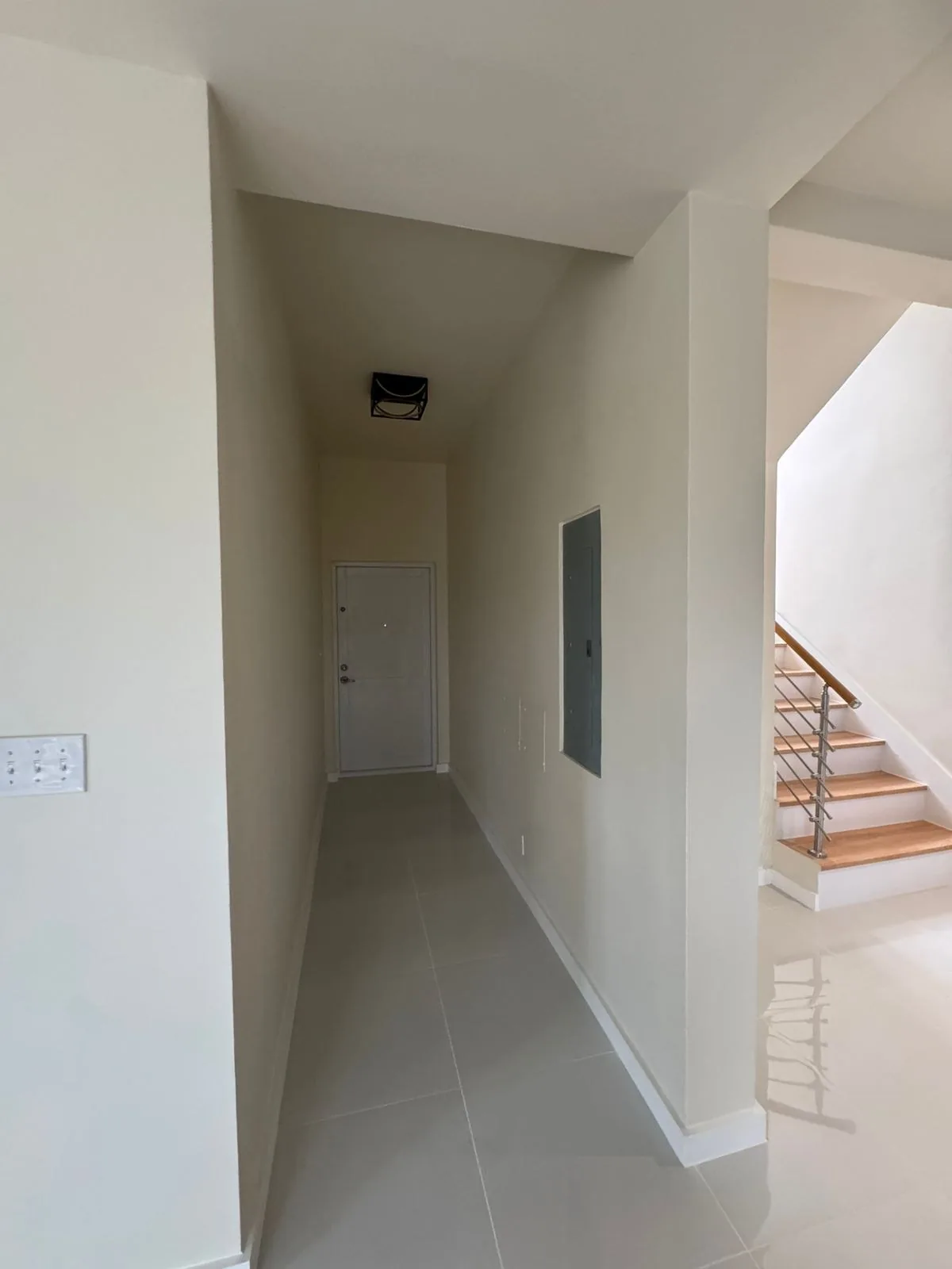 Hallway with white walk-in at the end