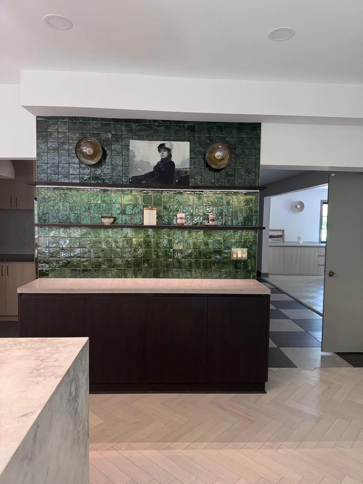 Entry desk with green mosaic tile feature and wood bench