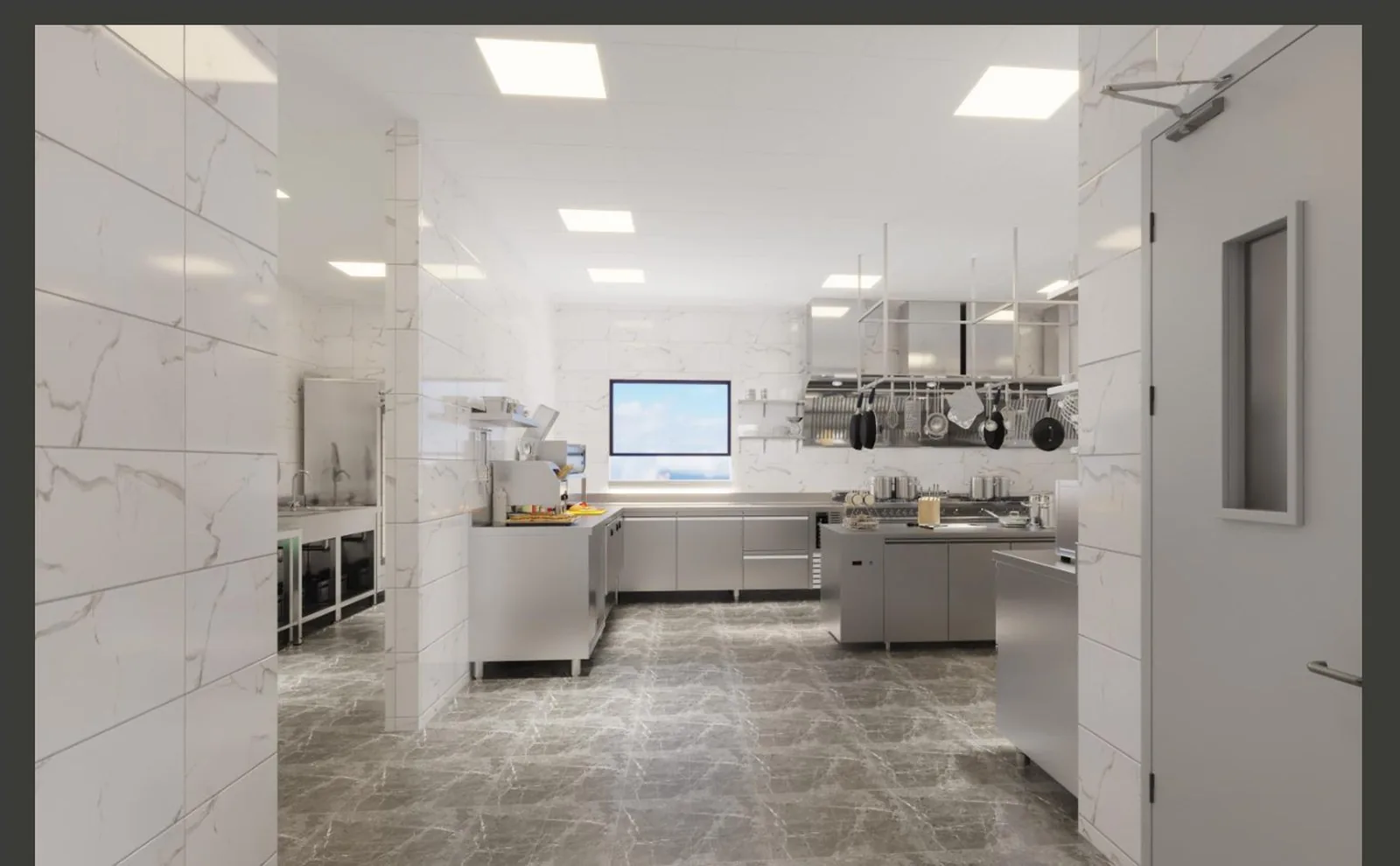 Commercial kitchen line with stainless equipment