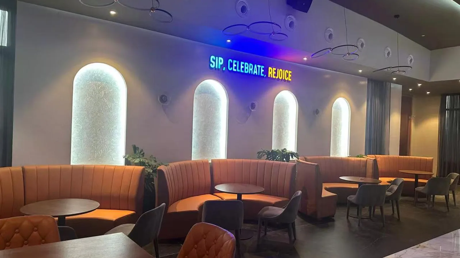 Banquette seating bays with upholstered backs in a restaurant