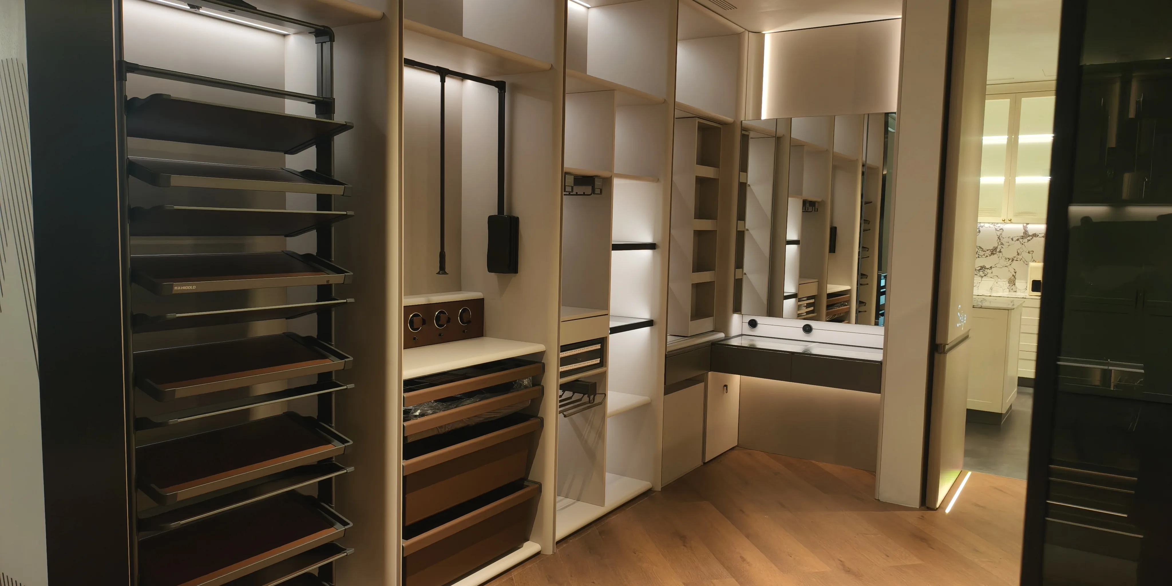 Walk-in closet with glass-fronted cabinets and a full-height hanging run