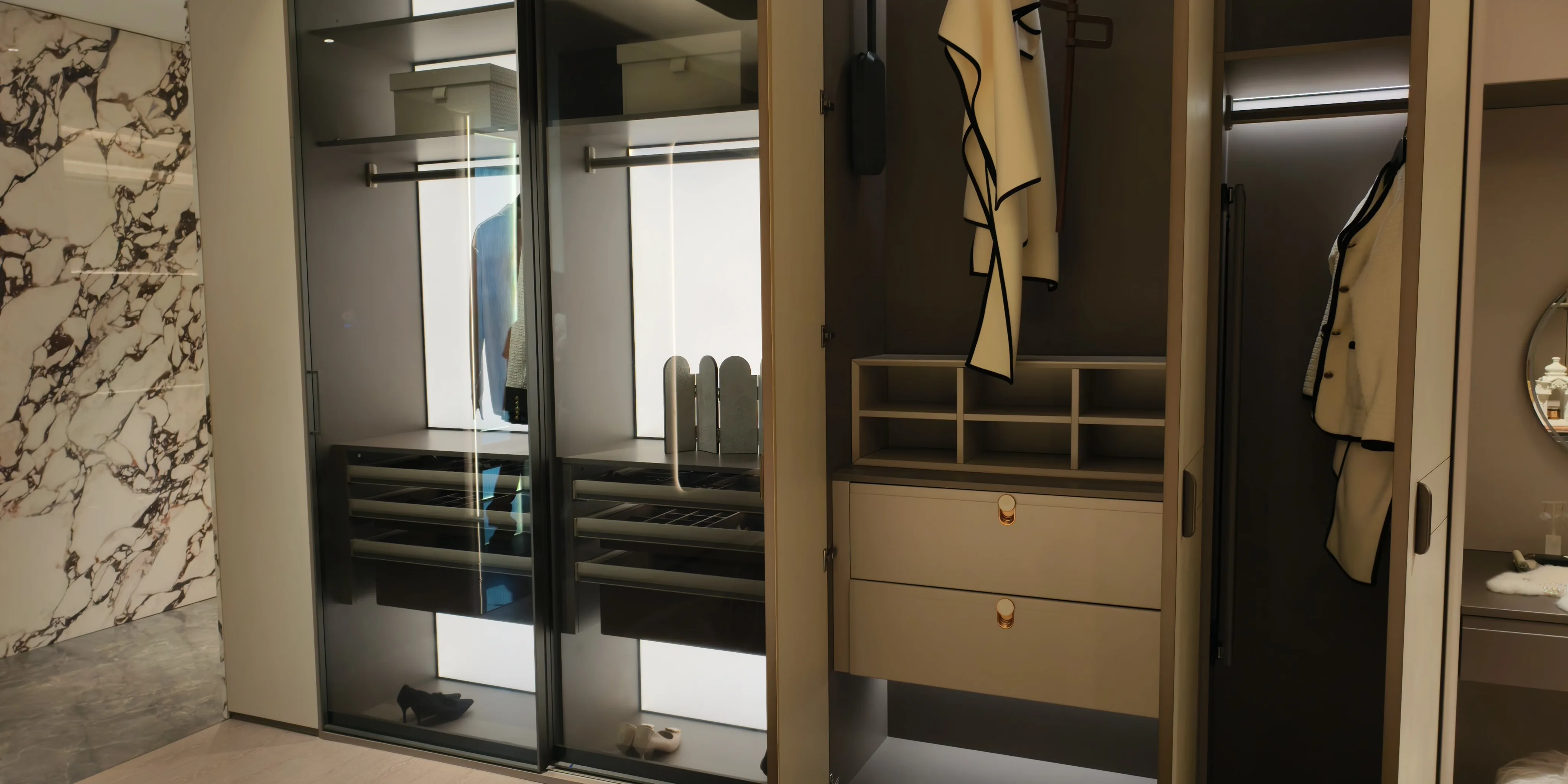 Wardrobe hanging zone with lit shelving and full-height rails