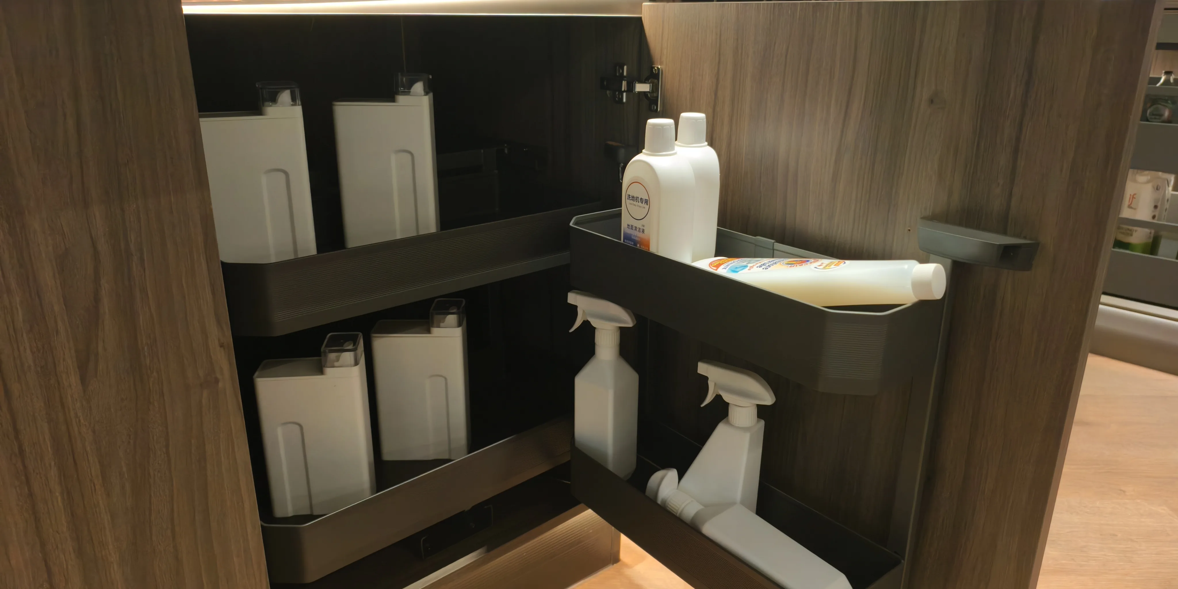 Pantry cabinet interior with adjustable shelves and pull-out storage