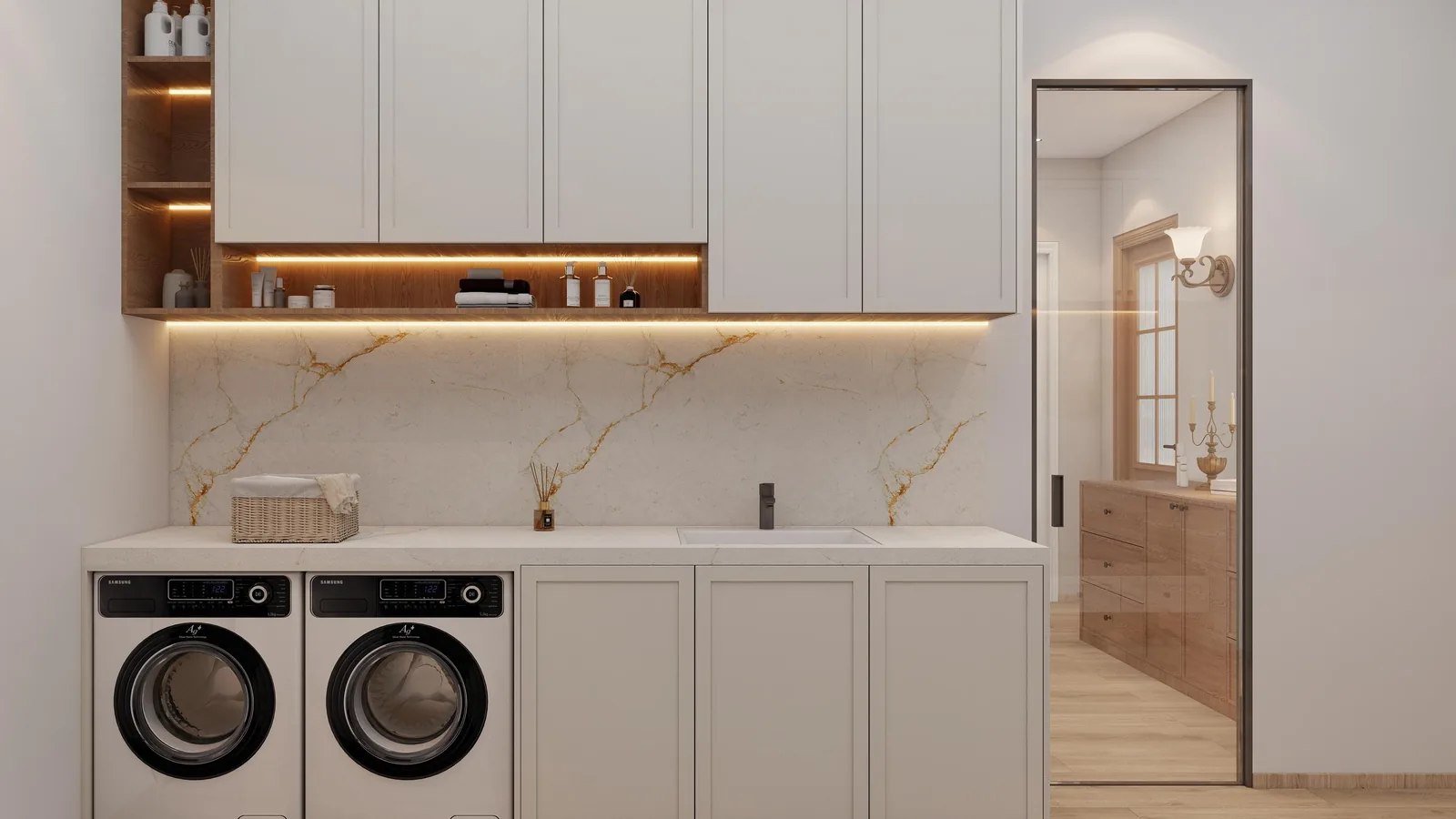 Laundry room with washer and dryer under a continuous counter and tall storage
