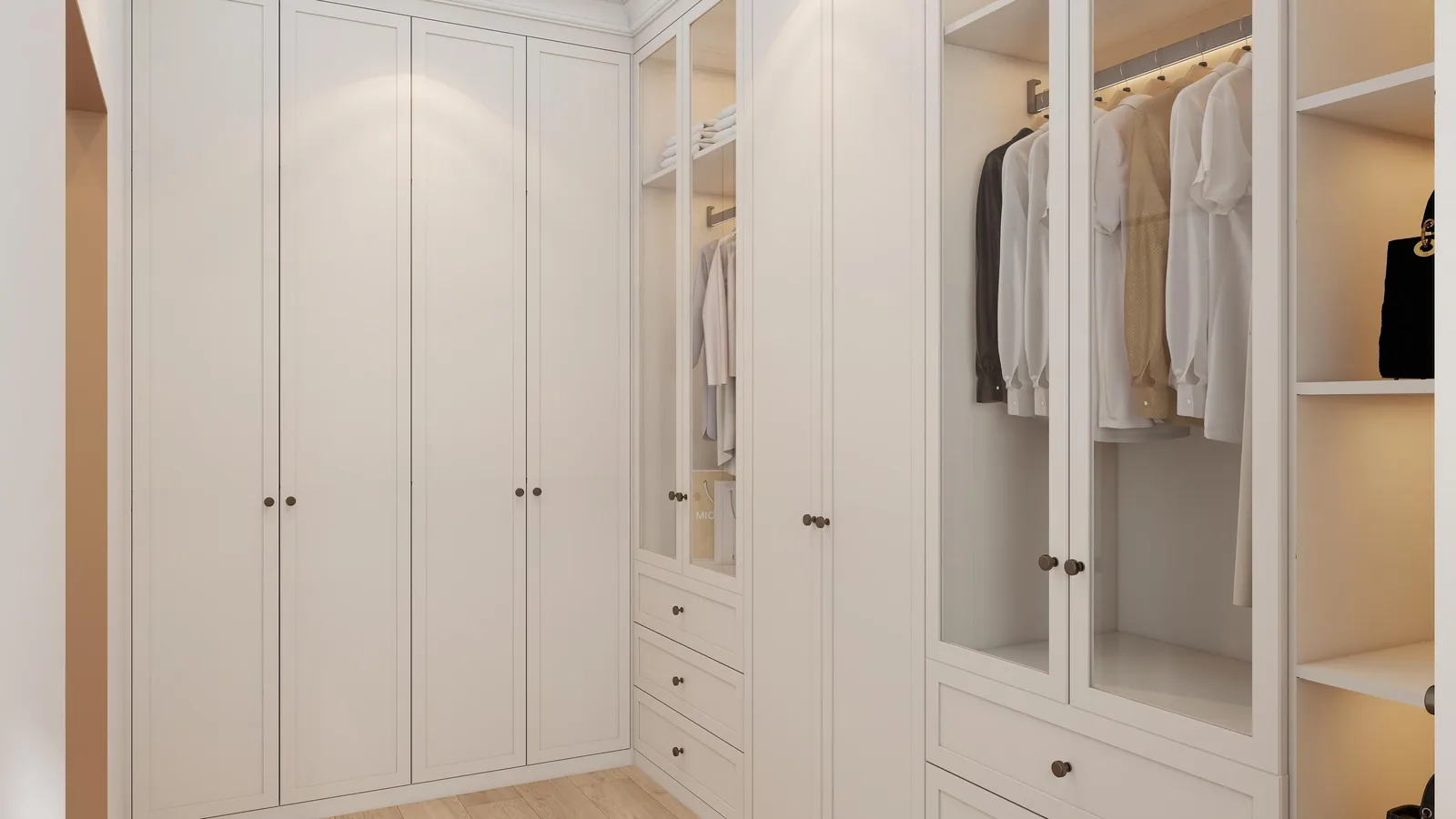Walk-in closet with island drawer bank and hanging on both sides