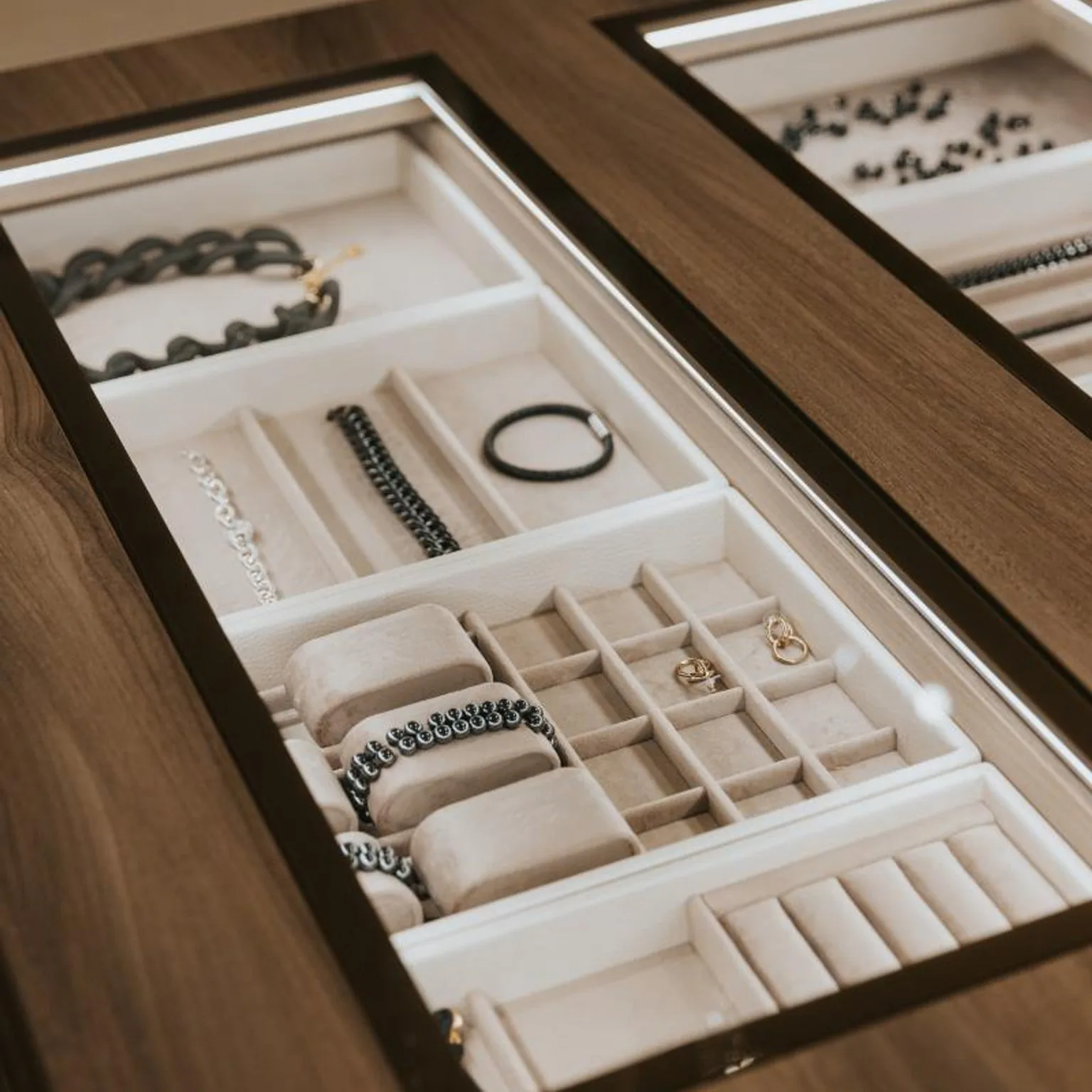 White jewelry trays with necklace bars and ring slots