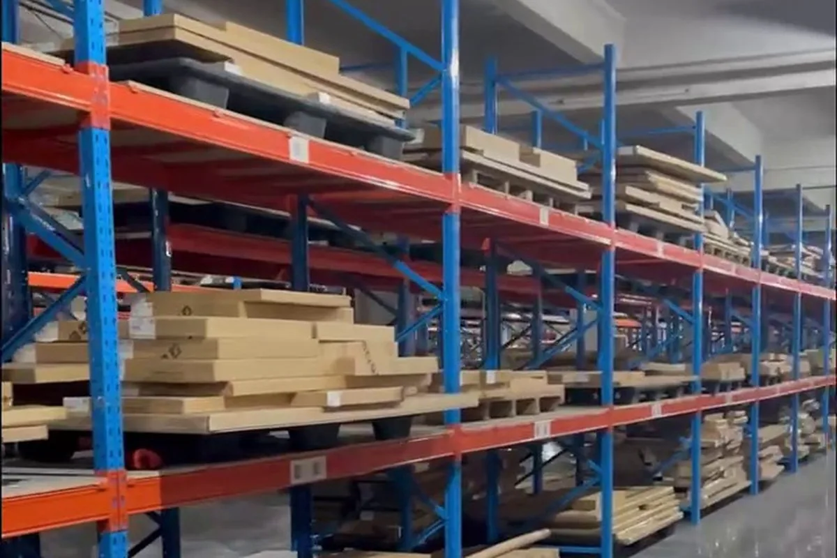 Board racks in the raw-materials warehouse, graded panels waiting for the line