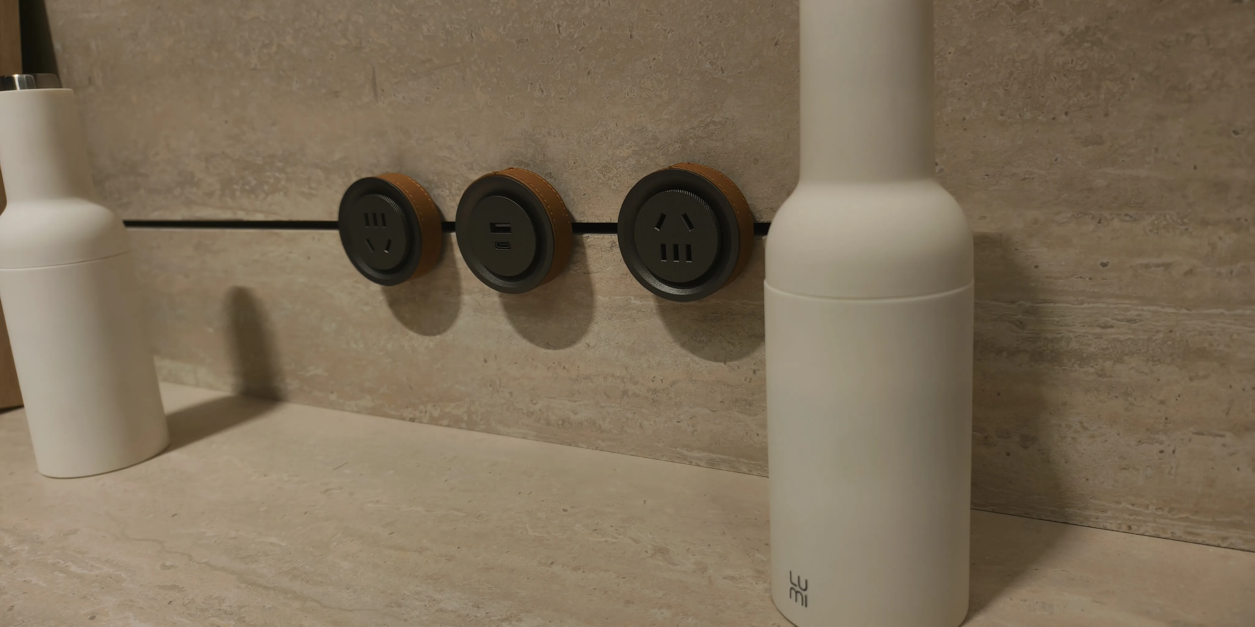 Track-mounted power fittings fitted inside cabinet shelves