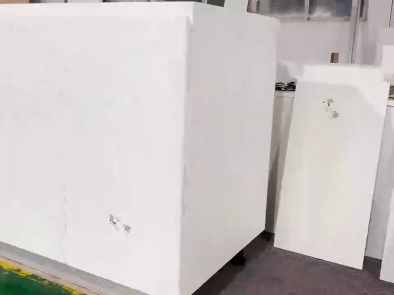 Carcass panel assembly on cam locks and wooden dowels - factory installation video frame