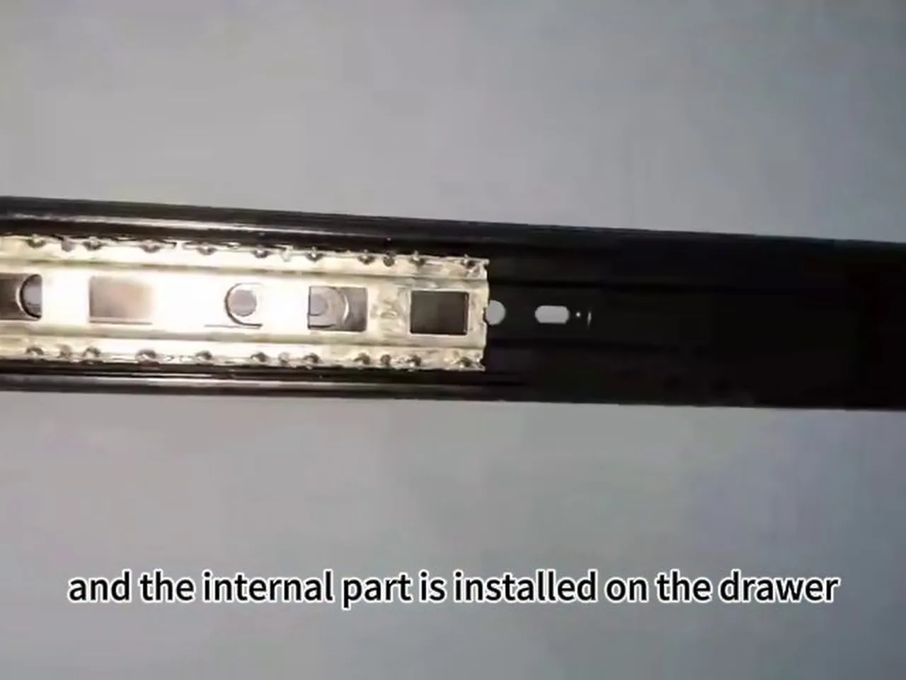 Full-extension drawer runner with the internal part installed on the drawer - factory installation video frame
