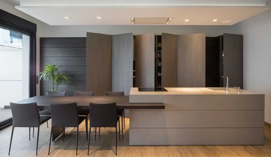 Bright kitchen with island and dining wall