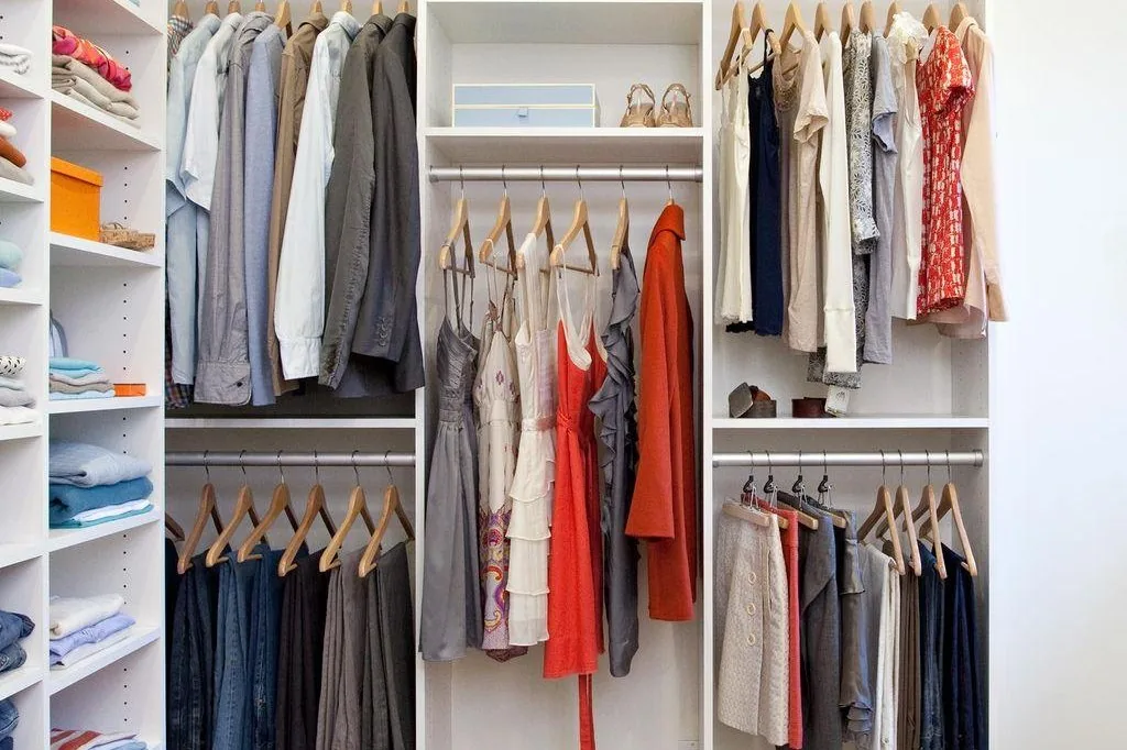 Walk-in wardrobe with hanging rails, drawers and LED shelves