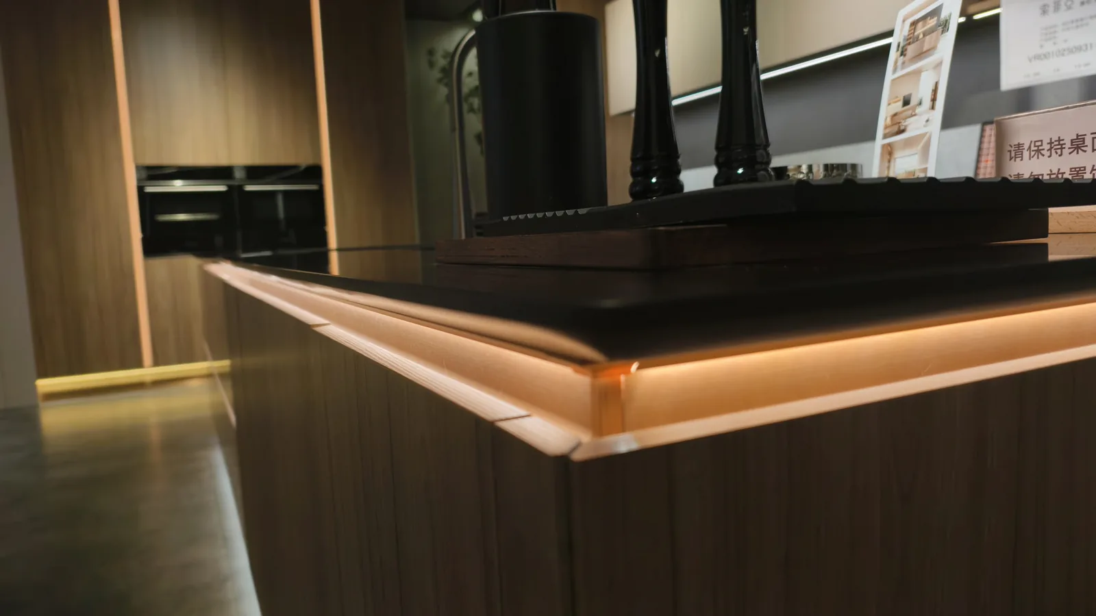 Dark timber island with lit base units