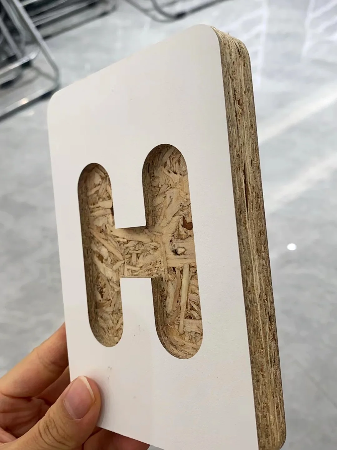 Cut sample showing the particleboard core inside a cabinet panel