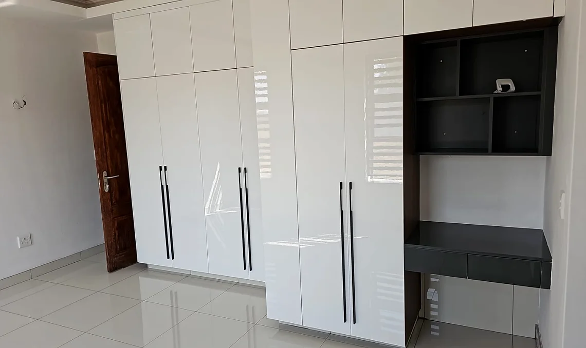 White gloss wardrobe with open shelves, installed for a South African project