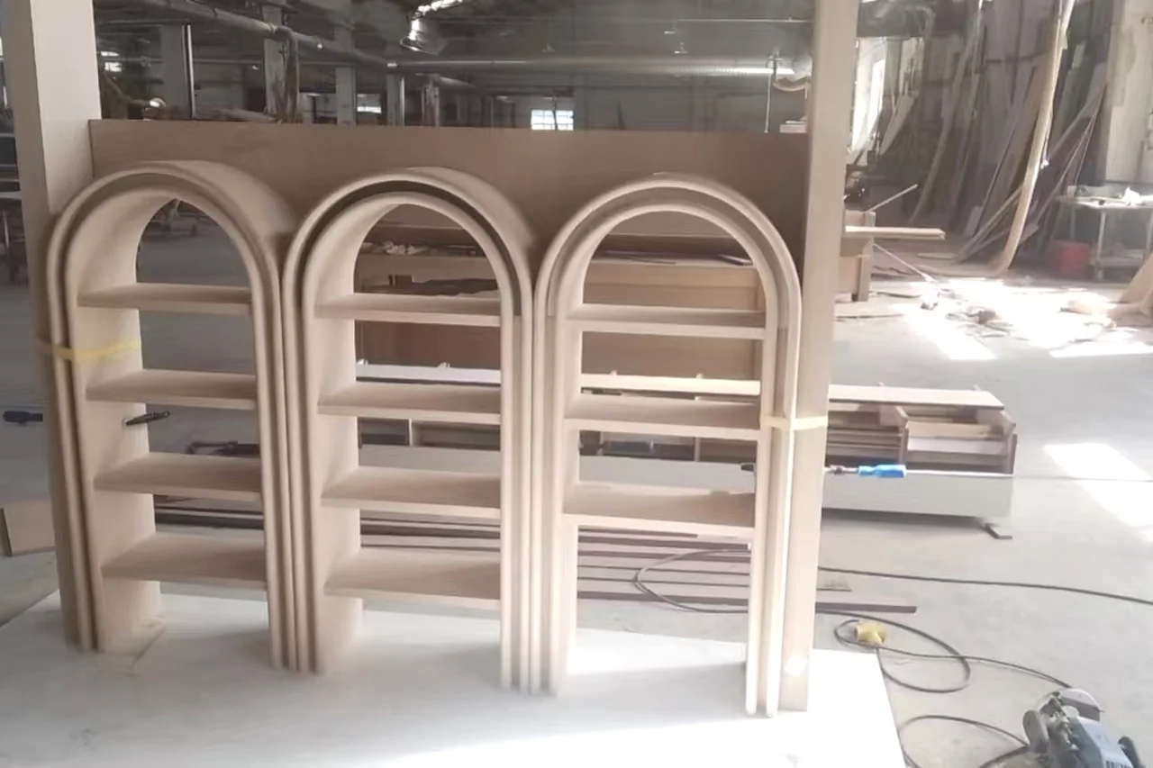 Curved door frames stacked in the workshop after forming