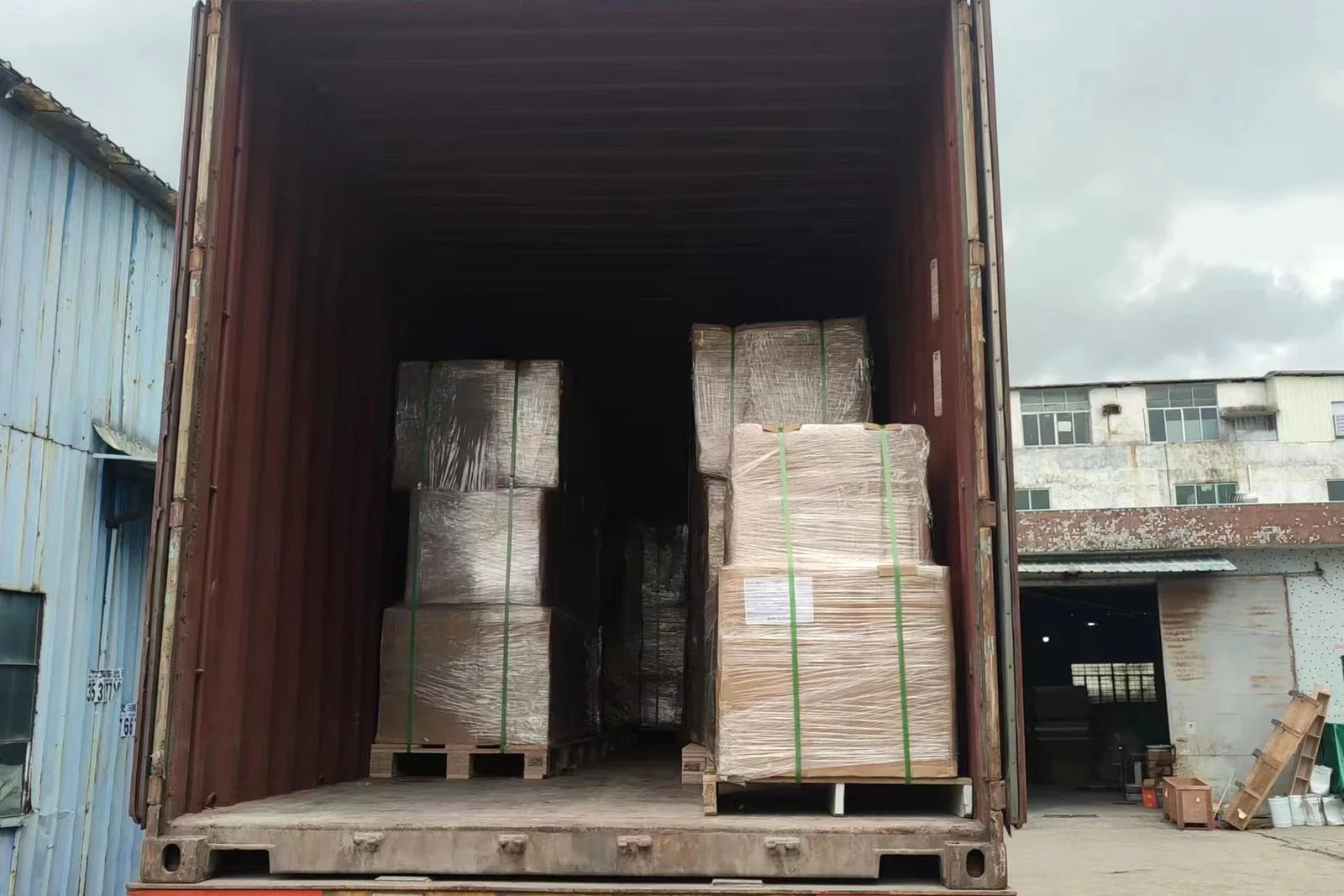 Forty-foot container loaded with flat-pack cabinet crates, ready for export