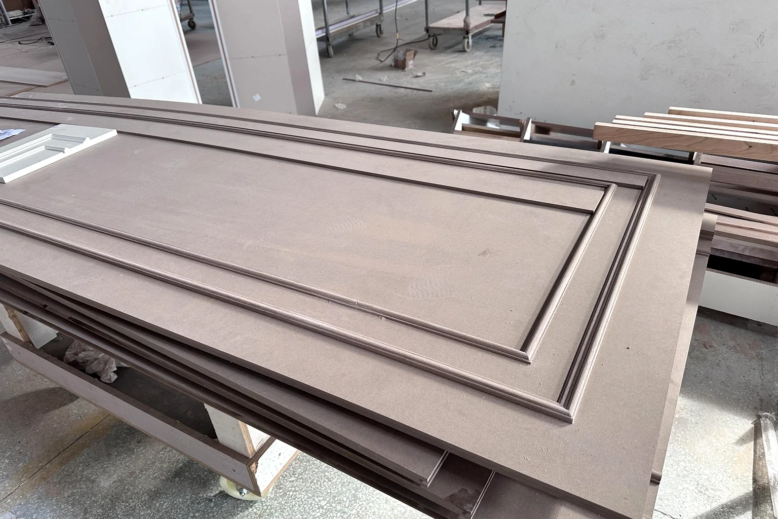 Door frames laid out on the workshop floor during a shaker run