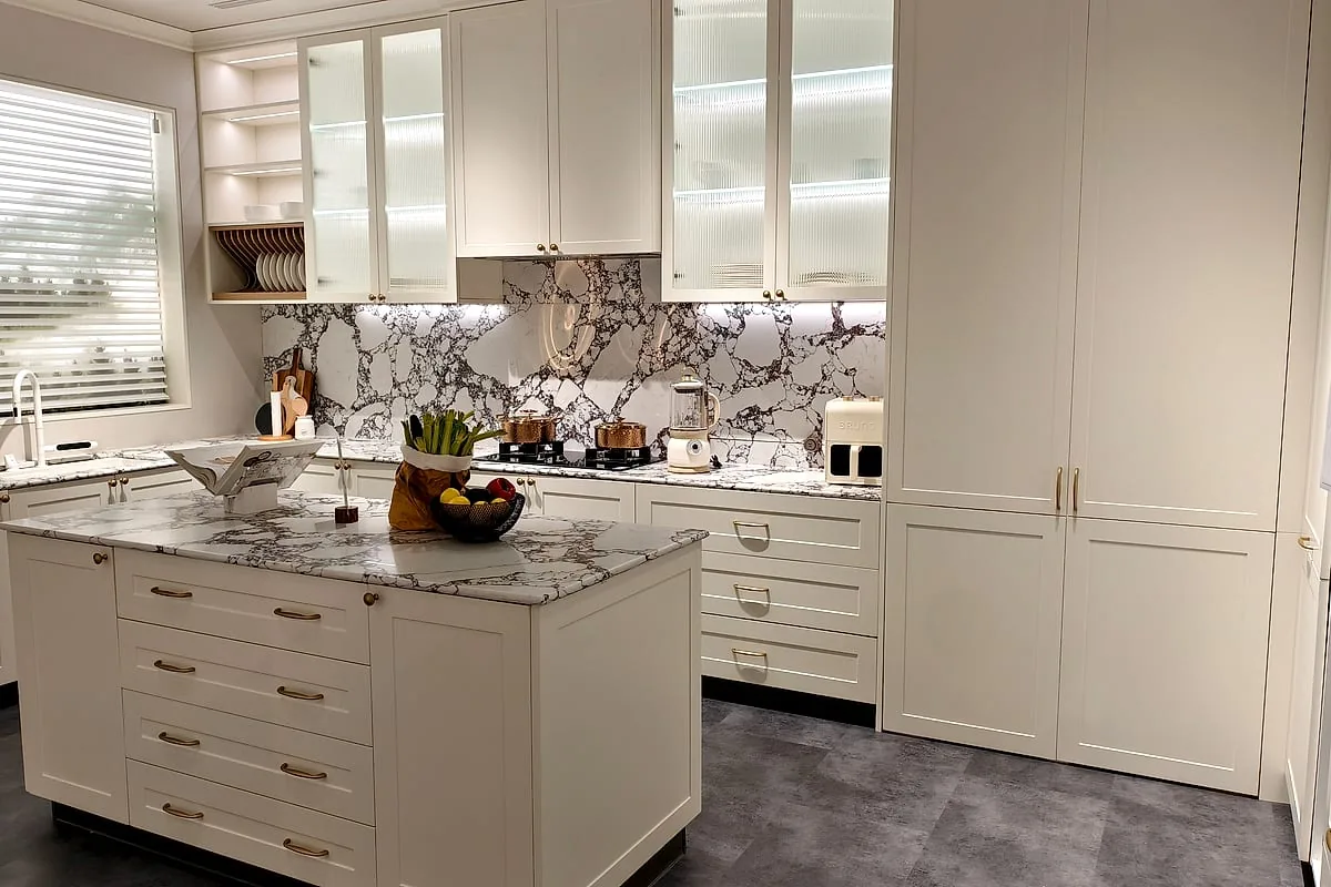 Custom kitchen cabinet run with marble island