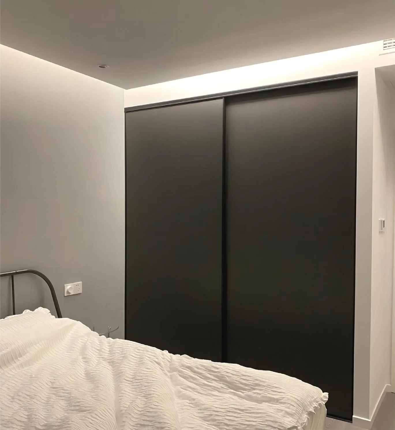Bright study wall with built-in wardrobe